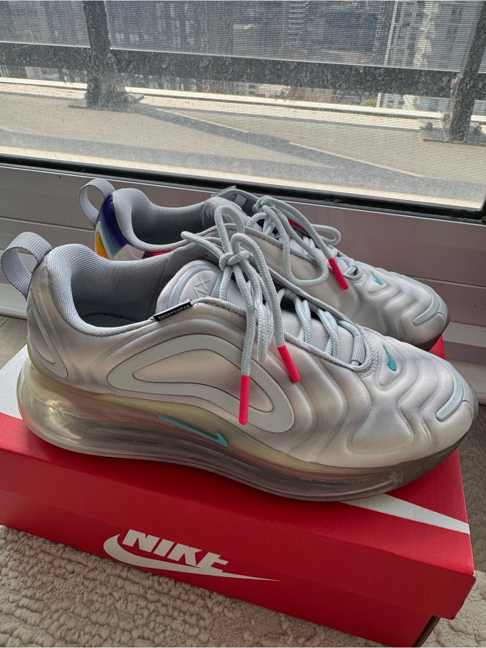 Nike Women’s Silver Iridescent Sneakers with Pink Accents
